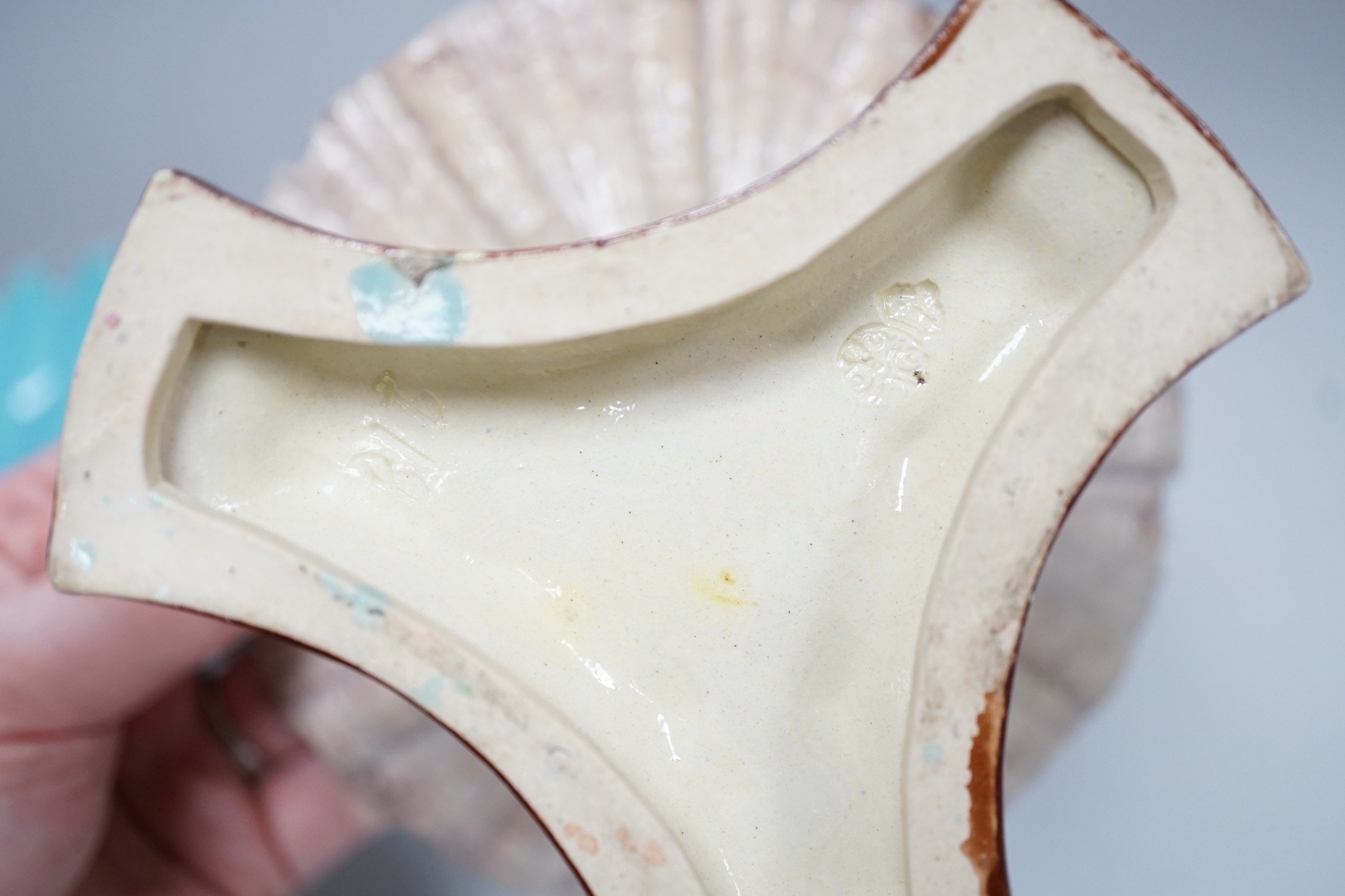 A pair of late 19th century Royal Worcester majolica dolphin comports, 10cm tall